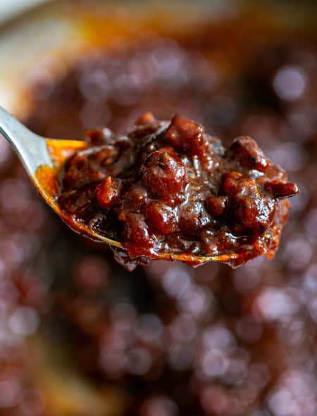 a spoon of bacon jam with bbq sauce