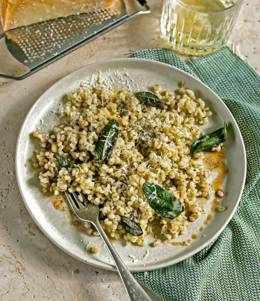 Buttery Parmesan and Sage Pearl Barley on a white plate 