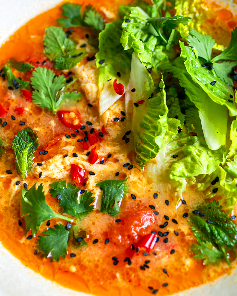 Close up of a bowl of Tom Yum Egg Drop Soup