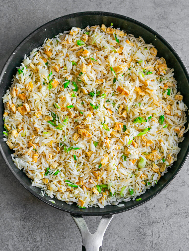 large nonstick frying pan filled with egg fried rice