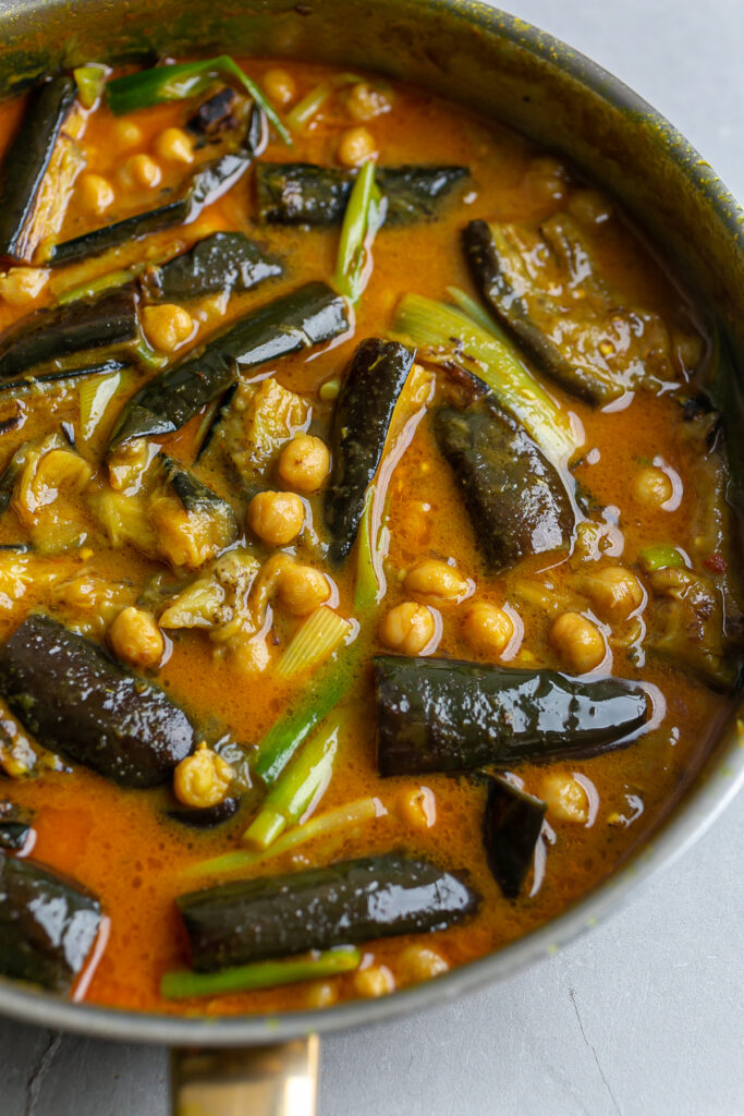 Large pan filled with Fragrant Aubergine Coconut Curry