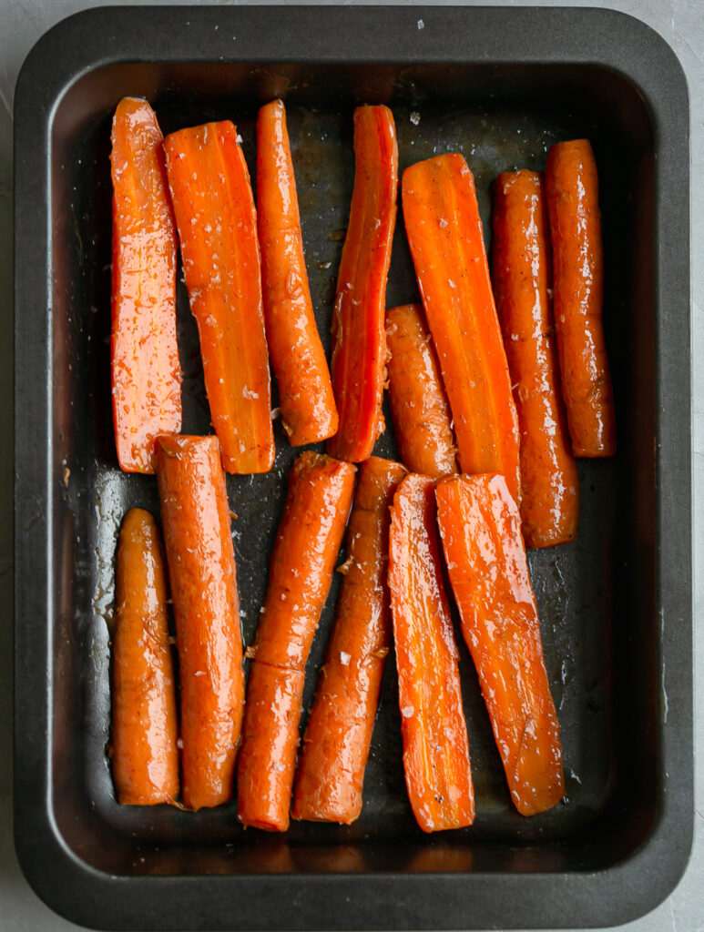 Maple Mustard Glazed Carrots on an oven roasting tray