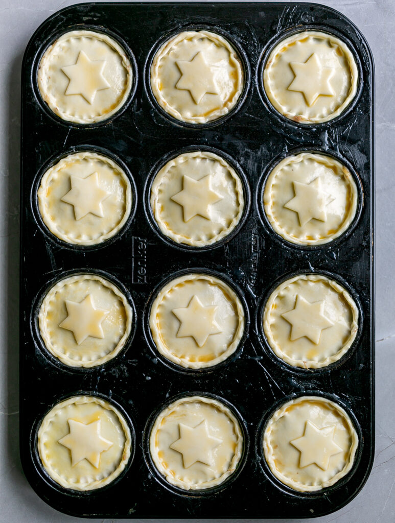 Muffin tin filled with Mini Beef Brisket Pies