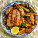 Large Italian plate of Roast Chicken with Vermouth, Oregano and lemon roasted potatoes