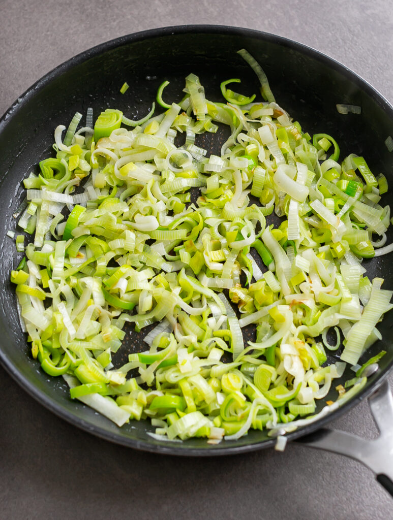 frying pan with finely chopped sauteed leeks 