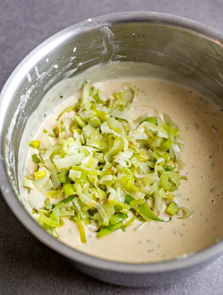Pot filled with Bechamel Sauce and sauteed leeks